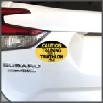 CAUTION Training For A Triathlon 70.3 Runner Decal or Car Magnet